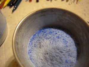 Reduction frit is frit that gets  metallic effects when placed in a reducing (more gas that o2) flame. It is blue in raw form.